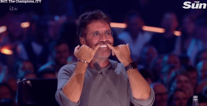  Simon showed off his perfect gnashers