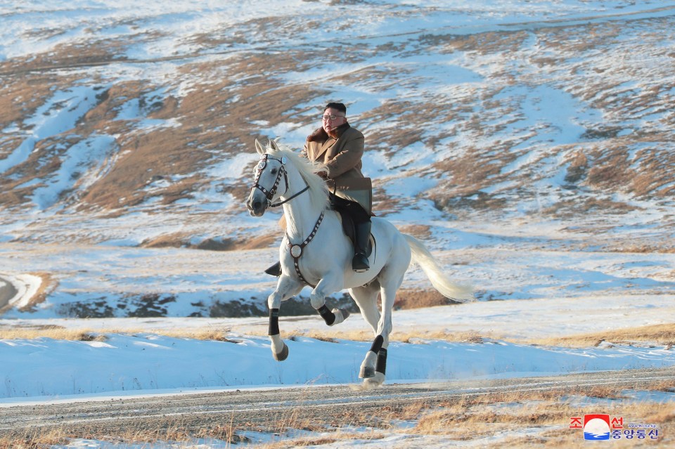  Galloping Kim races across the snowy peaks in new photos depicting him as a man of nature