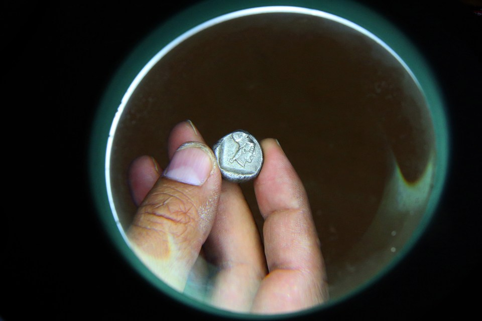  This is one of a number of ancient silver coins discovered, it is thought to be Late Archaic