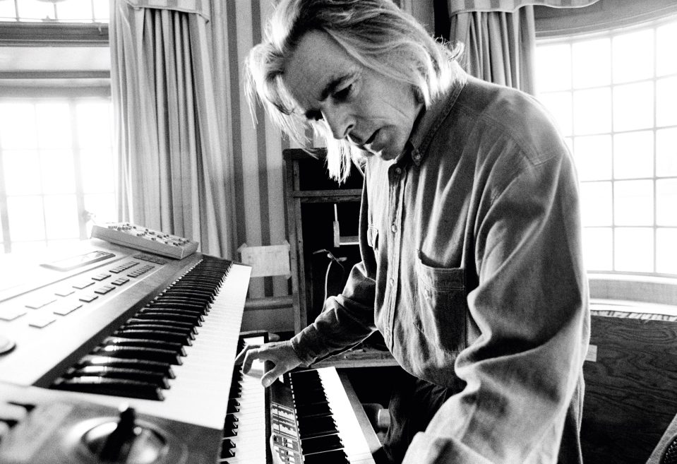 Richard Wright plays the keyboard on a houseboat in 1993