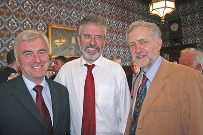  labour chiefs John McDonnell and Jeremy Corbyn smile in a photo-op with Gerry Adams
