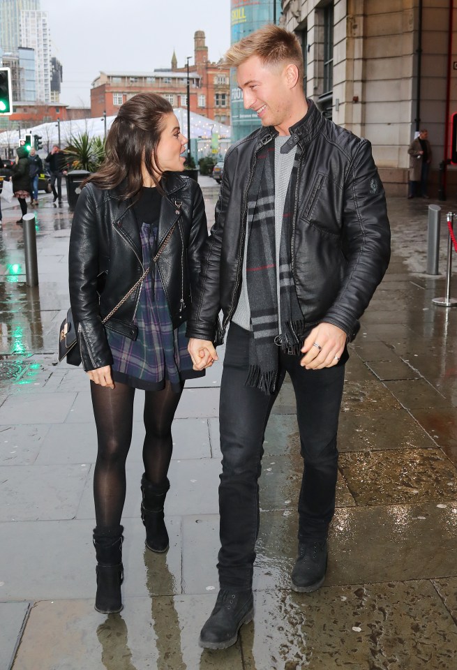  Faye looked giddy as she held her beau's hand walking to The Hard Rock Cafe