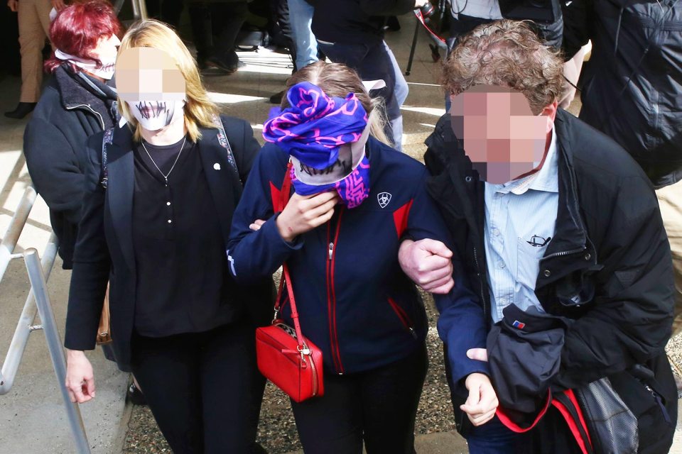 The teen and her mum wore masks with stitches on the lips as they left court in protest of her treatment