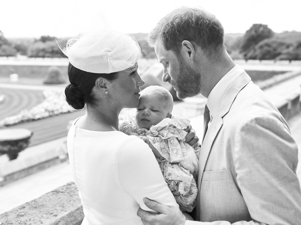 The new parents posed in a photo on the day of Archie's christening