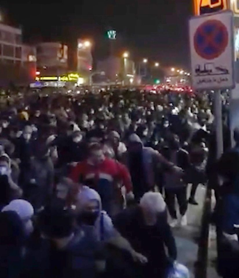  Crowds of protesters flee after gunshots rang out in Tehran
