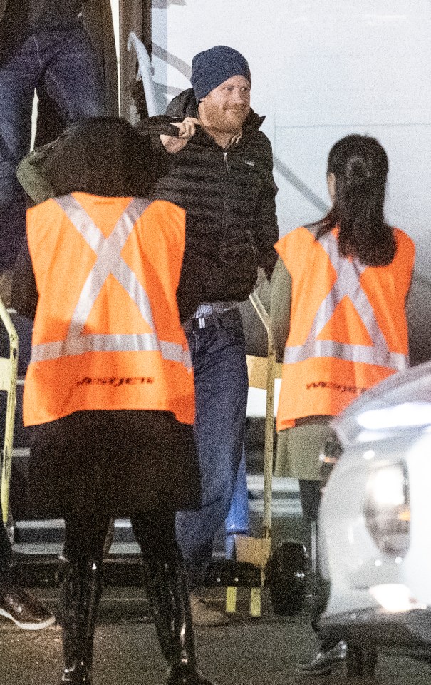 Prince Harry smiled as he arrived in Canada to reunite with Meghan and Archie
