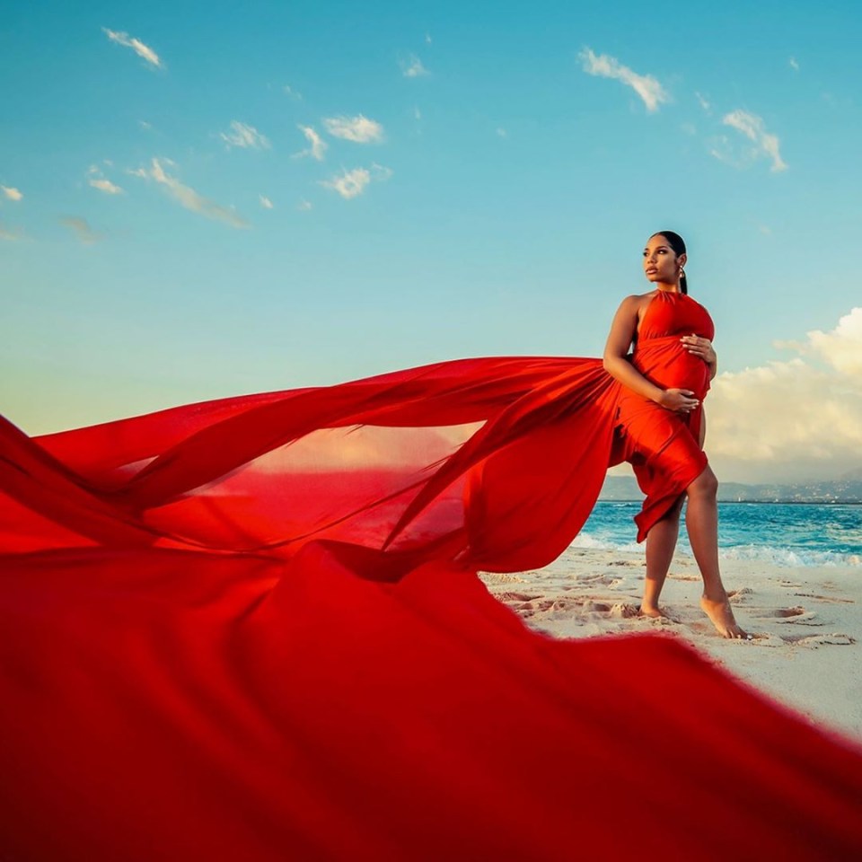  Kasi poses in a stunning red dress after Bolt broke the news of her pregnancy