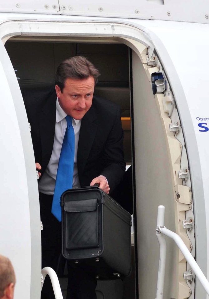  The gun and passports were found in the World Traveller Plus section as Mr Cameron sat in Business Class - Mr Cameron pictured in 2010