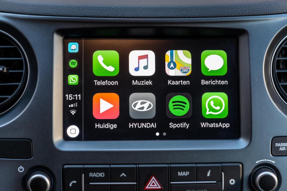 Apple CarPlay apps displayed on a car dashboard.