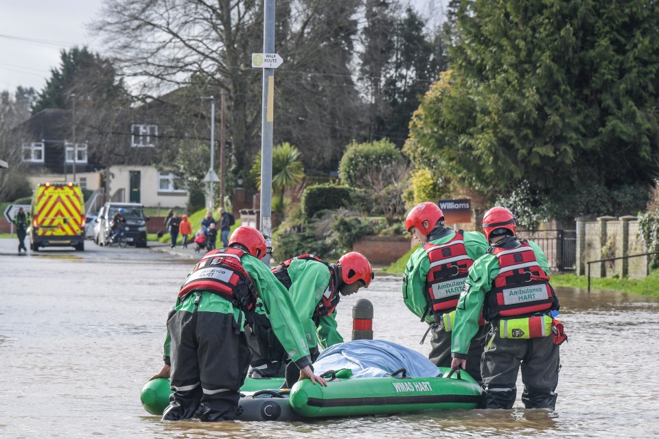  A man is rescued by paramedics using a raft on Hinton Road in Hereford