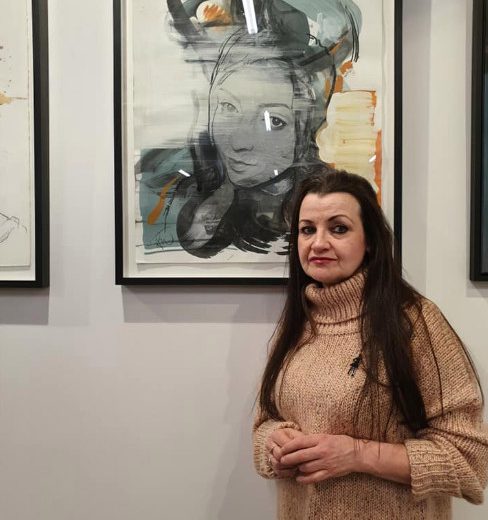  Andrea, pictured in front of a painting of Georgina, will never stop searching for her girl