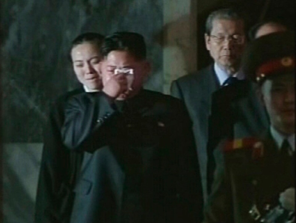 Kim Jong-un pictured weeping as his father lies in state in 2010