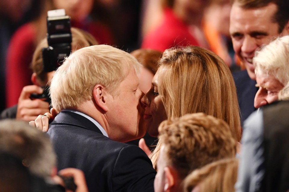  Boris kisses Carrie after his keynote speech during the 2019 Conservative Party Conference in Manchester