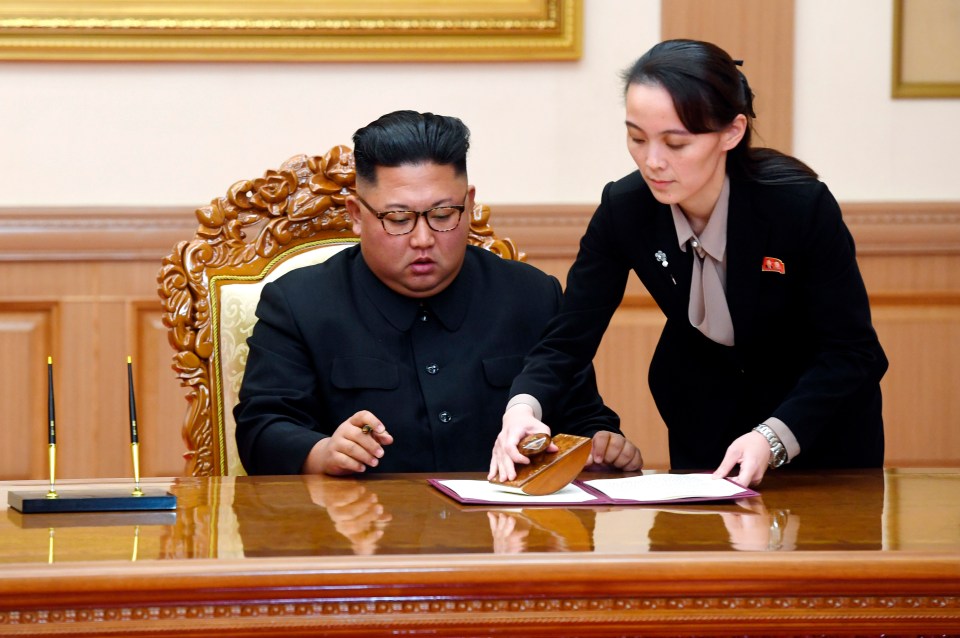  Kim Yo-jong helps her brother sign a joint statement with South Korea on September, 19, 2018.