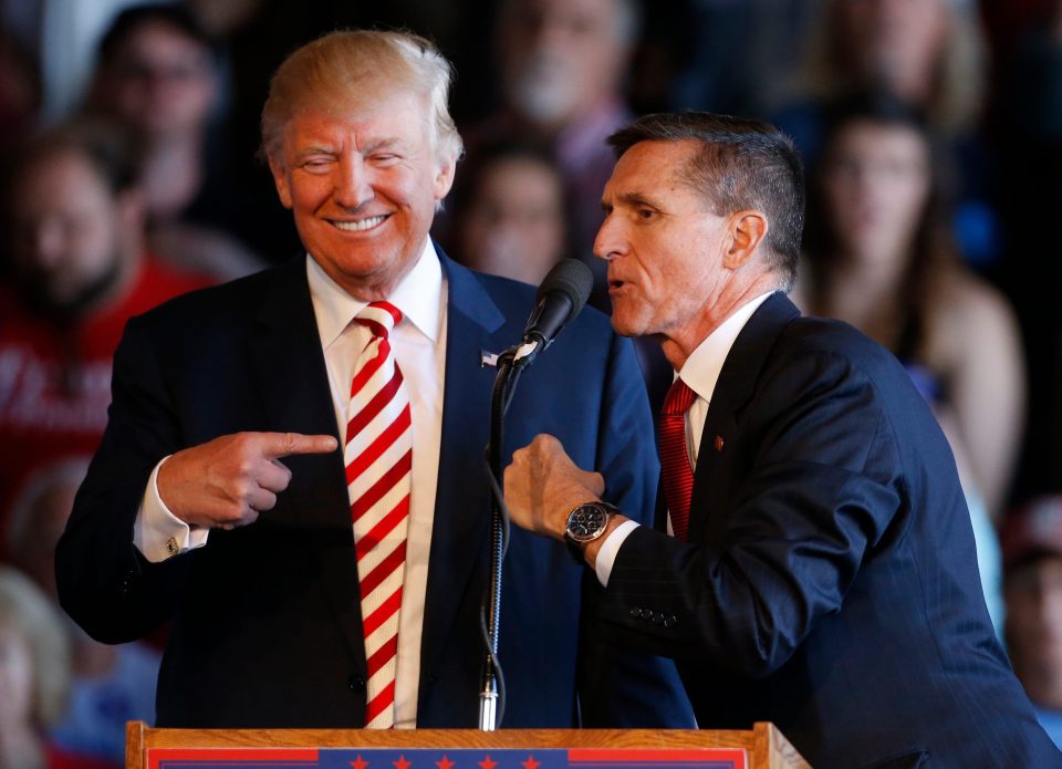 Donald Trump jokes with retired Gen. Michael Flynn at a rally at Grand Junction Regional Airport, 2016