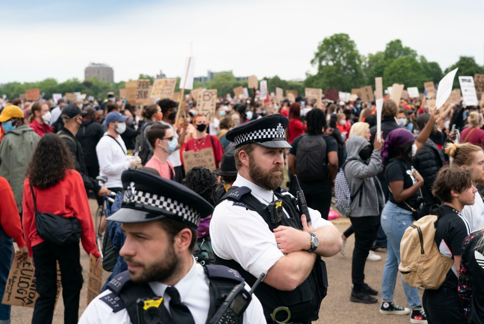  Police watch the protest