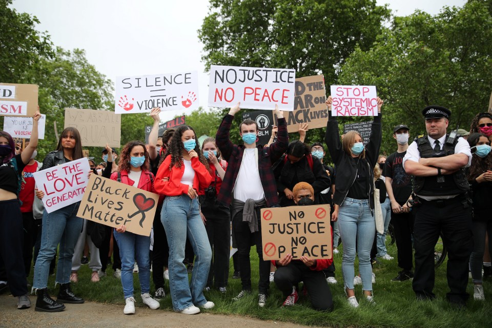  The activists hold signs in solidarity with the movement