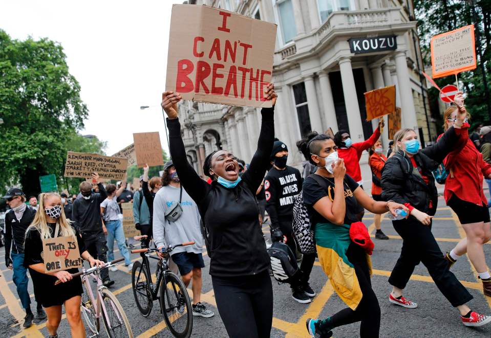 Demonstrators carried signs and chanted 'I can't breathe' as they marched