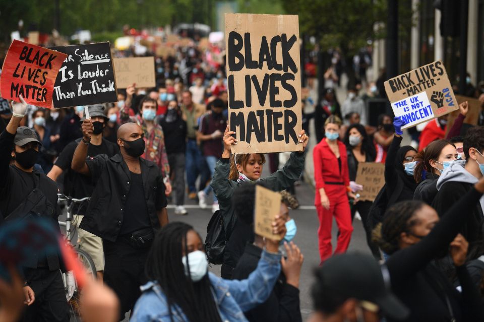  People marched down Park Lane holding signs as part of the movement