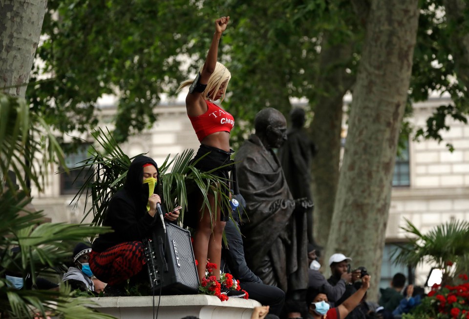  Protesters stood aloft statues in the city centre