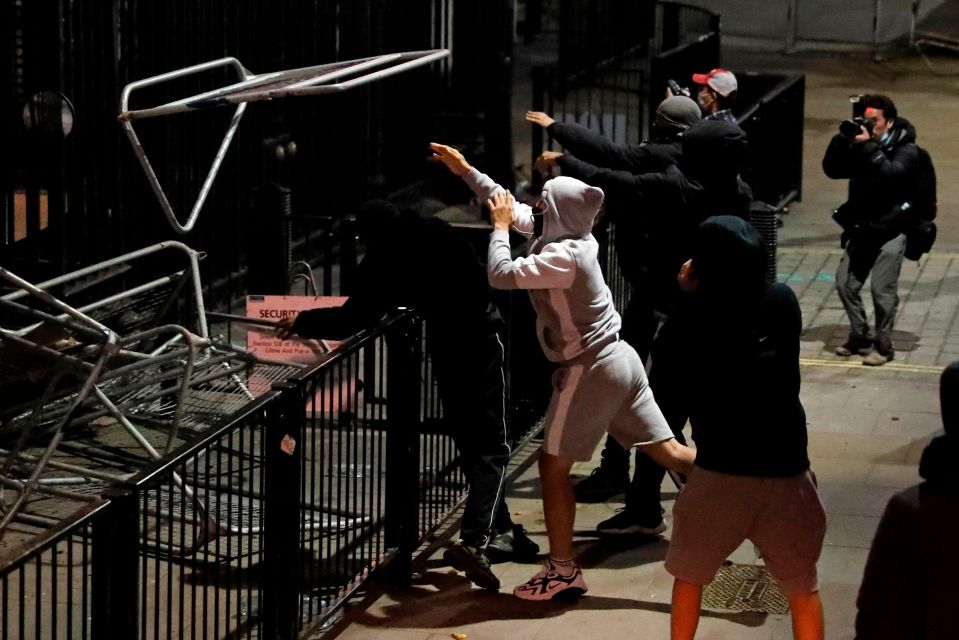  Barriers are thrown towards No 10 Downing Street