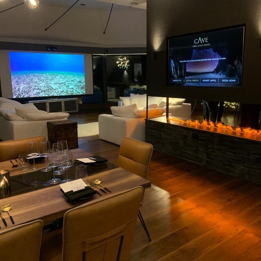 The penthouse suite has both a huge TV and TV screen