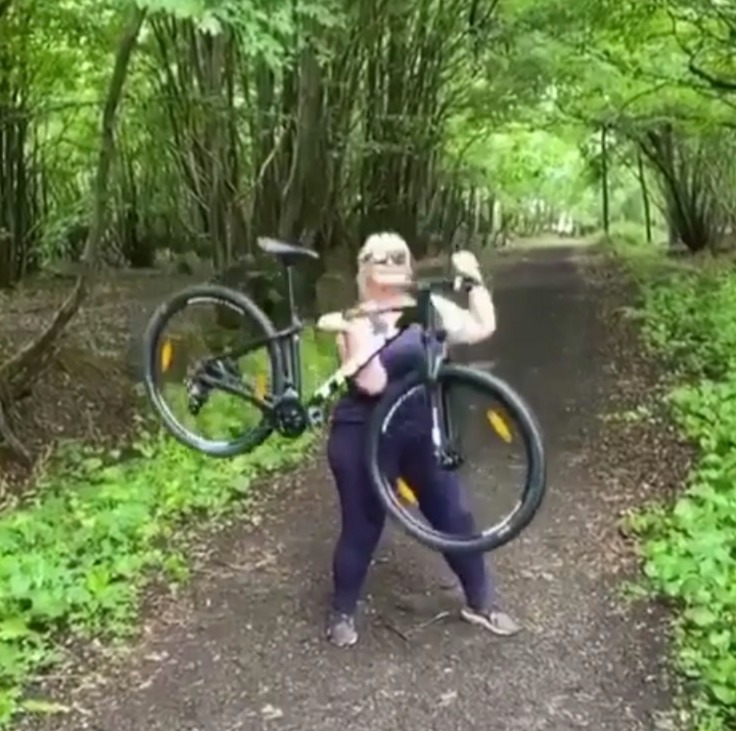 She's been working out – even using her bike as weight