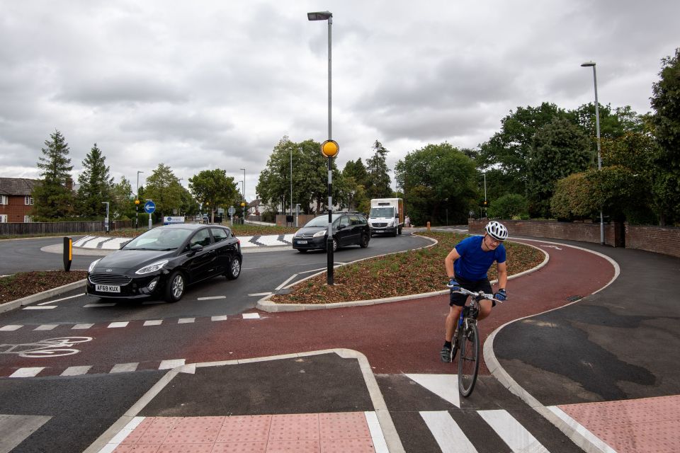 Reduced lane widths on the roundabout and at exit and entry points are designed to encourage car drivers to slow down