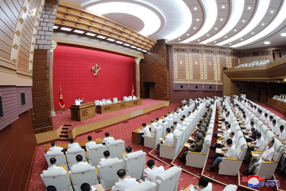 A photo purportedly taken on August 19 shows Kim chairing a meeting of scores of members of the Central Committee of the Workers’ Party of Korea