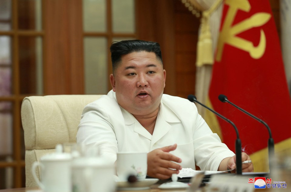 Kim Jong-un smokes a cigarette as he discusses the health crisis posed by coronavirus