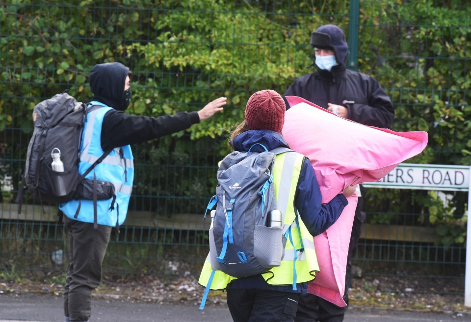 Protesters wearing face masks are seen at the demonstration