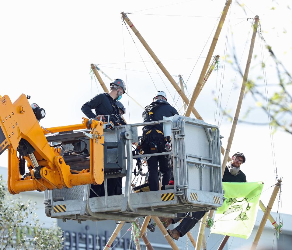 Police used a cherry picker to reach protesters