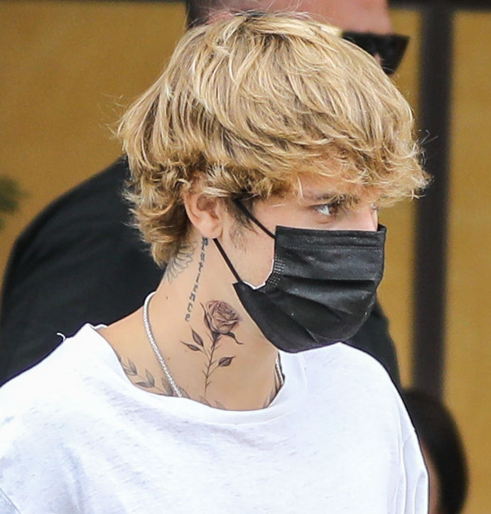 Justin Bieber has added a rose to his growing tattoo collection