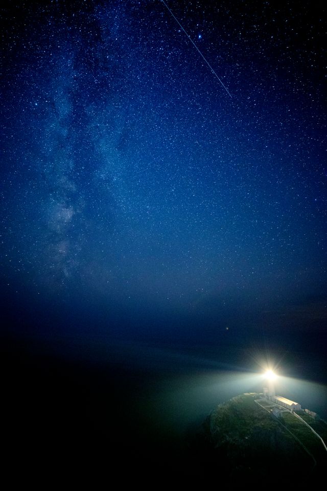 The Milky Way seen behind South Stack lighthouse on the Isle of Anglesey, North Wales