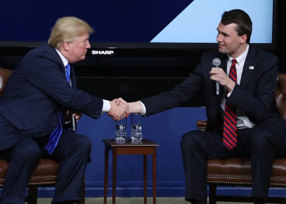 President Donald Trump shakes hands with conservative activist Charlie Kirk at a forum dubbed the Generation Next Summit at The White House