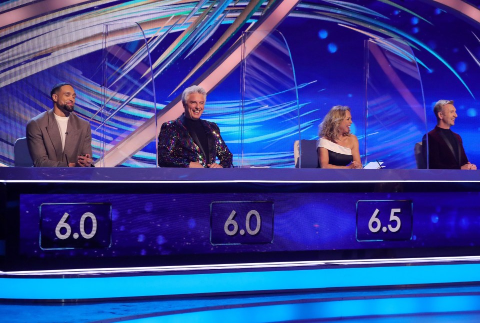 The judges are separated by Perspex screens