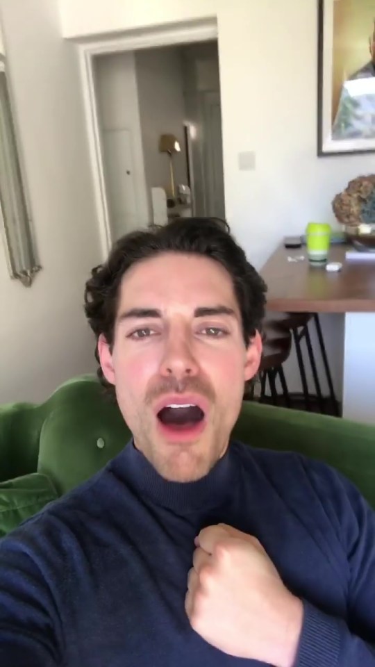 Tom has a comfy velvet green sofa to relax on in his living room
