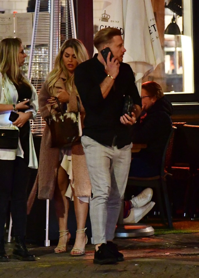 He chatted intently on the phone as he left the restaurant