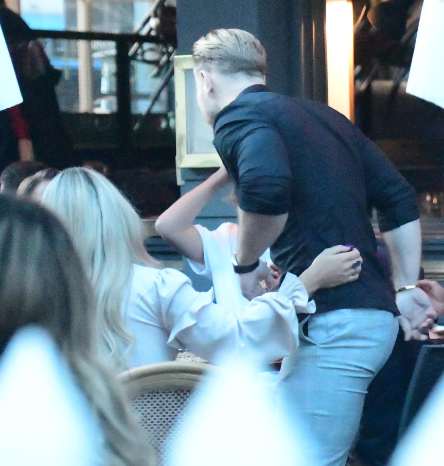 Bianca put an arm around her ex-boyfriend's back