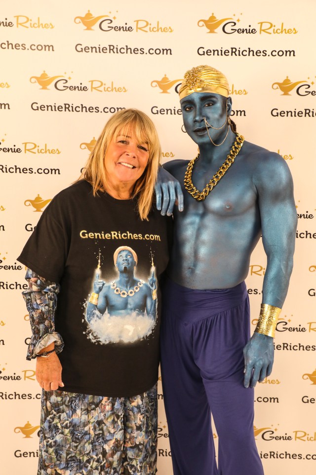 Linda looked delighted to pose with the hunk