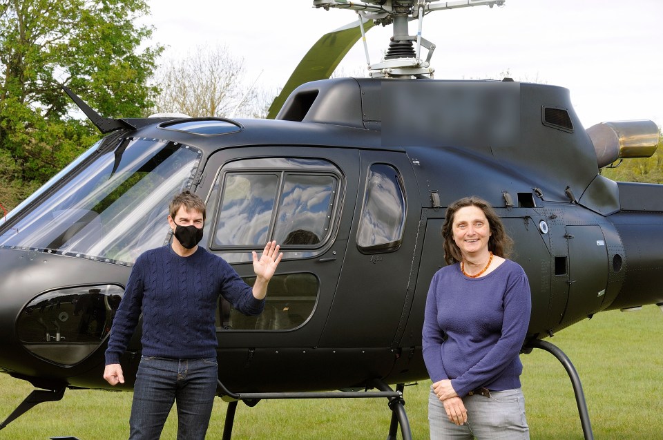Tom ensured that social distancing rules were met as he posed next to a black helicopter