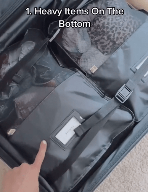 She advises putting heavy items at the bottom to avoid your suitcase being top heavy