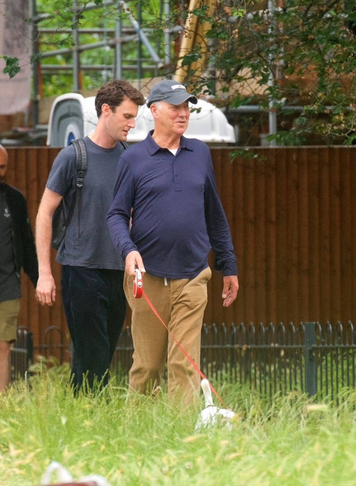 Michael Barrymore smiled as he walked his dog