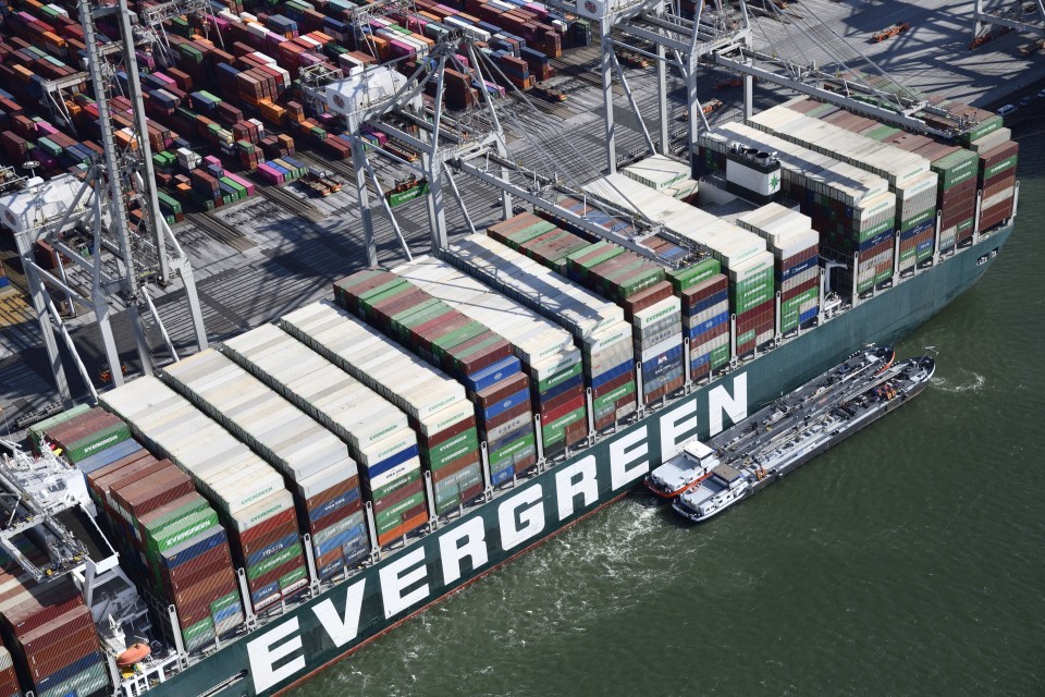 Tons of rotting food was offloaded from the giant container ship that brought world trade to a standstill