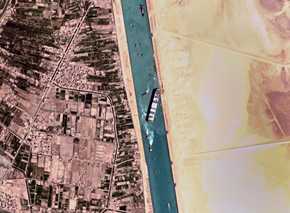 A satellite images shows tugs working to free the Ever Given from Suez