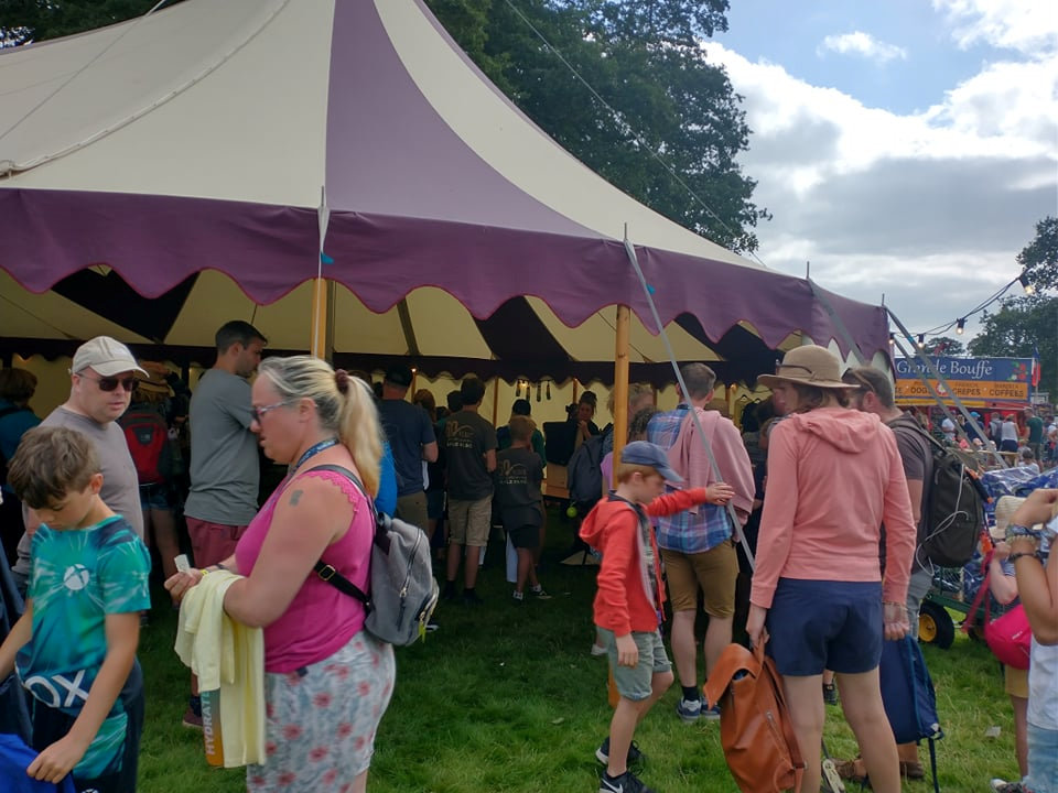 Families queued to get answers from the festival organisers after they were unable to book activities