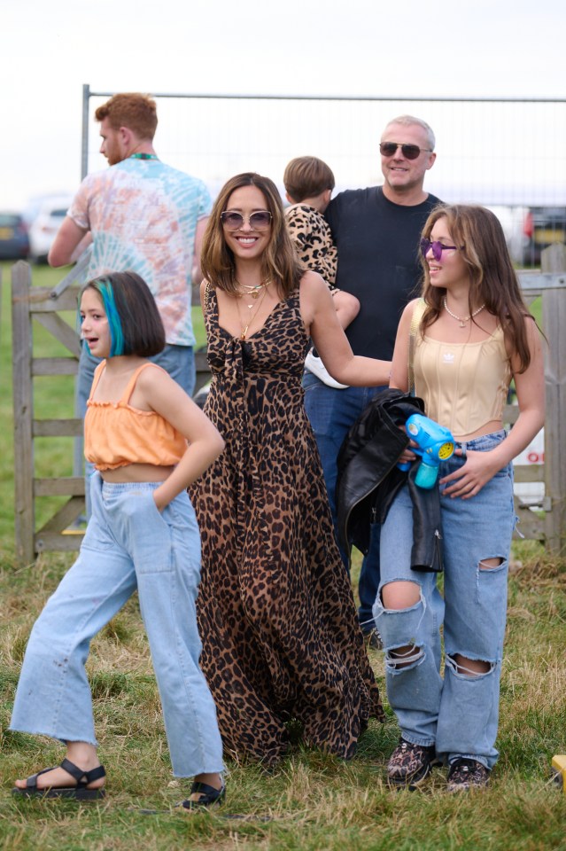 Myleene was all smiles as she walked around the field with her family