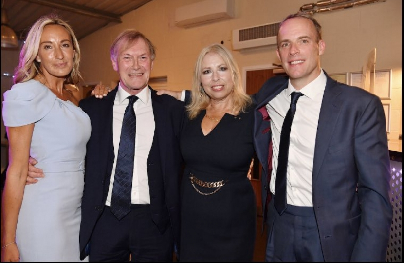 Sir David with Dominic Raab (right)