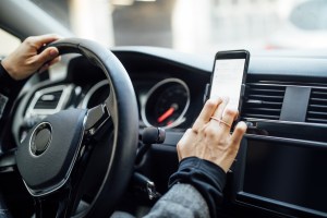  Drivers will be fined £200 if they are caught touching their phone