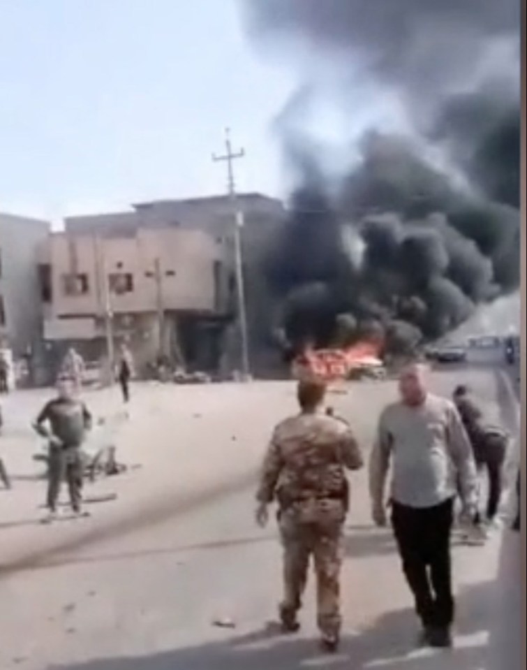 A car seen alight in the aftermath of the blast